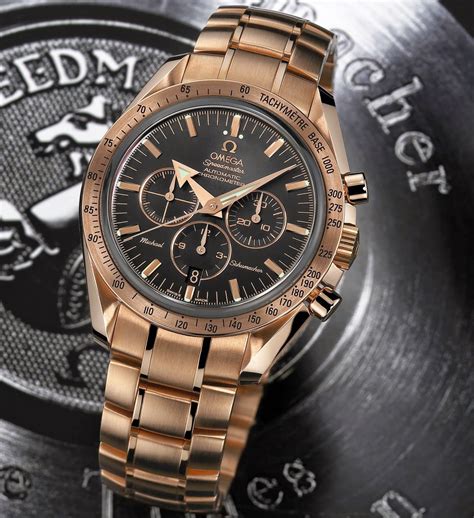 omega speedmaster broad arrow gold